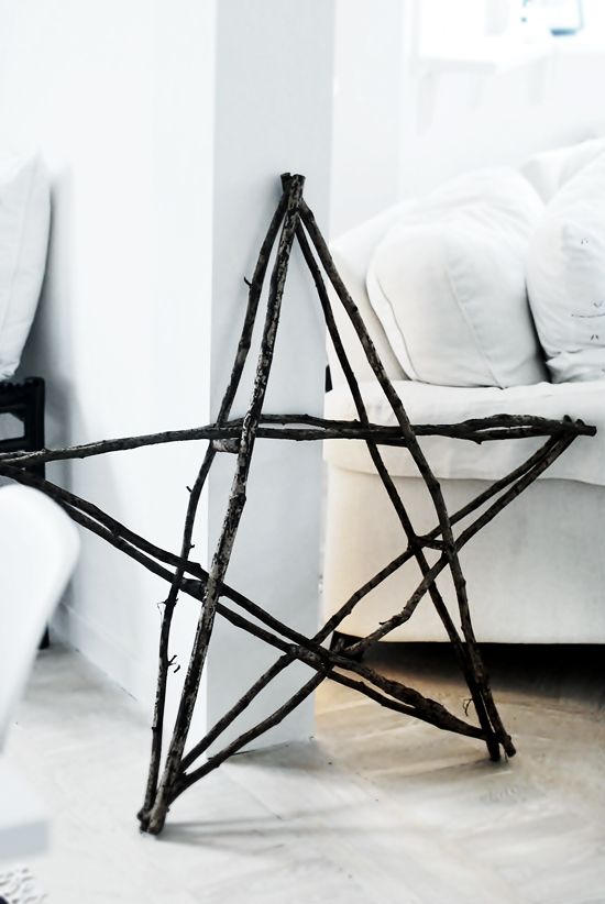 Make a star out of thin branches and then wrap with lights. Beautiful!