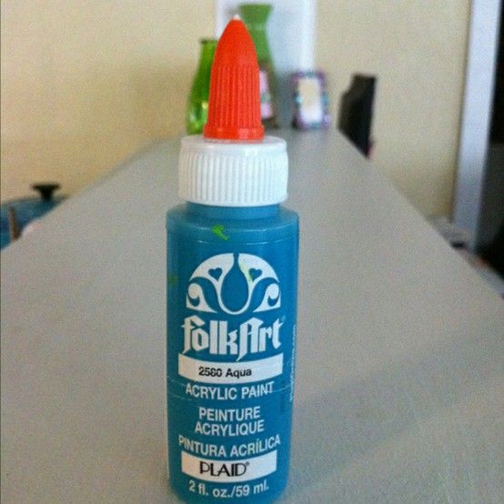 Put a glue top on acrylic paint bottle and you can write with it.