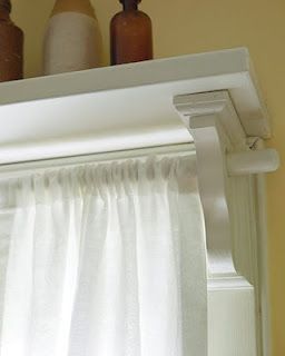Put a shelf over a window and use the shelf brackets to hold a curtain rod- geni