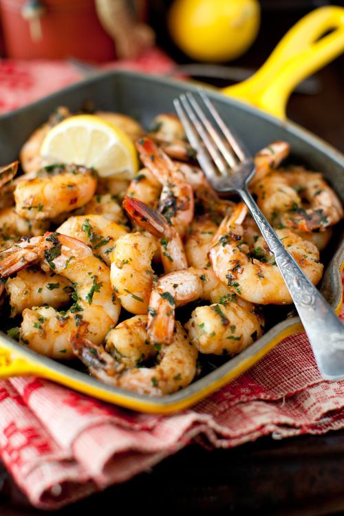 Sauteed shrimp with garlic, wine, olive oil, paprika, and lemon juice.  Yum!
