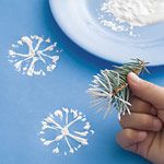 Snowflake stamping with pine needles.