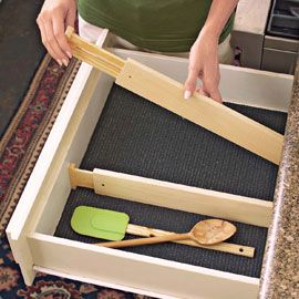 Spring loaded drawer dividers.