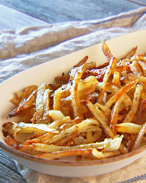 The secret to awesome oven fries is presoaking them in salted water, which makes