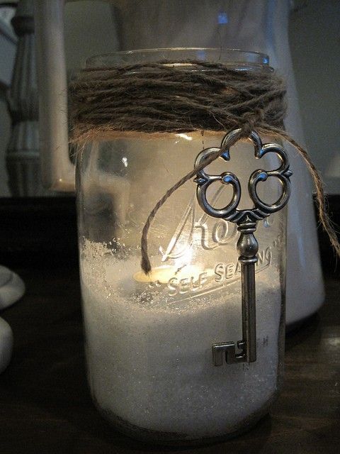 Use Epsom salt as filler in a jar. Place a tealight atop the salt. It will look