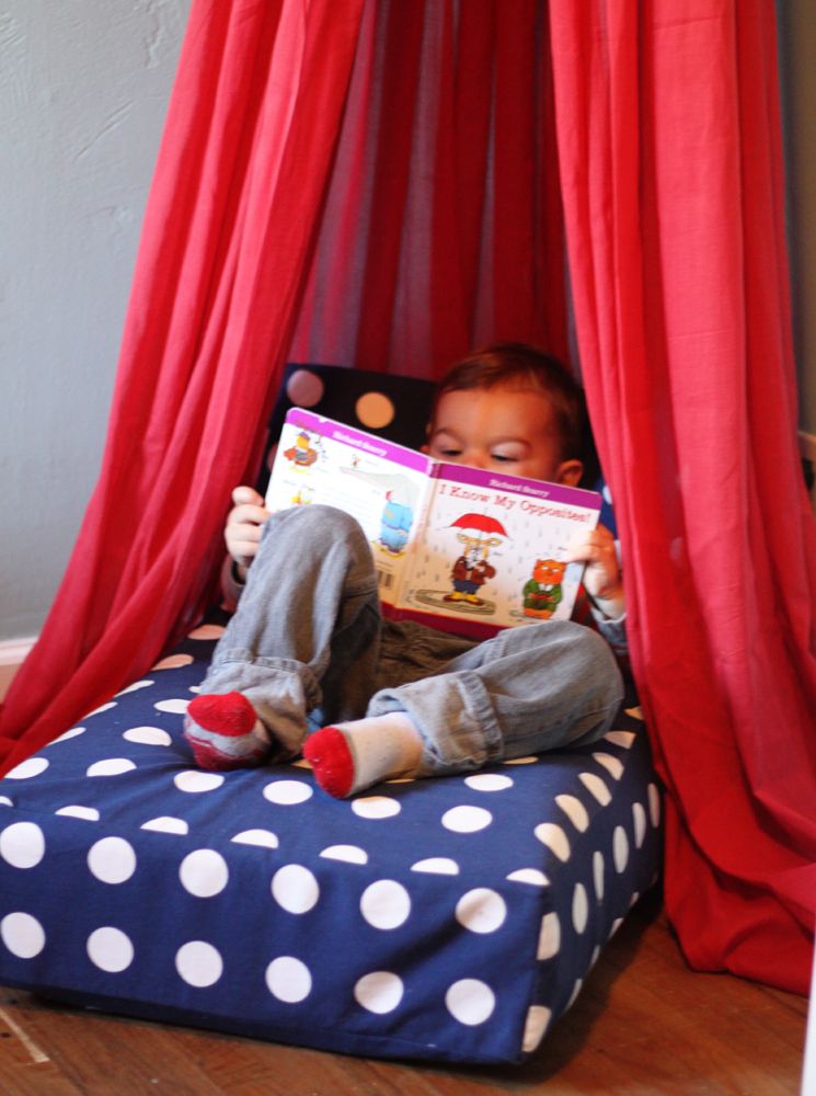 Use your old crib mattress for an upcycled reading nook!