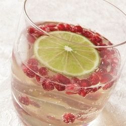 Winter White Sangria with Pomegranate and Lime…perfect for a holiday party.