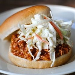 BBQ Beer Chicken made in the crockpot.  Serve it with coleslaw and a side of bak