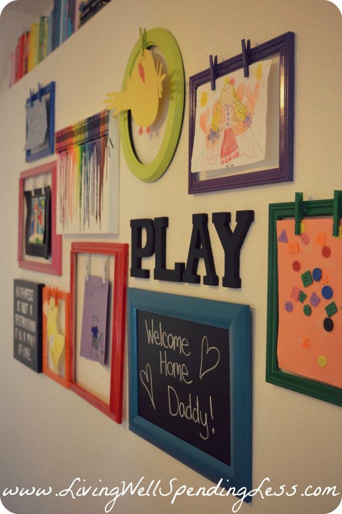 Clothespins on frames! Easy to change out new artwork from the kids. Love this w