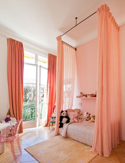 Curtains and wall in a peachy coral.  Love this for a girls room!