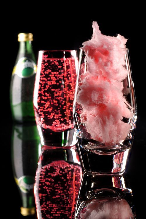 Fill glass with cotton candy and slowly pour champagne (or sprite) over it.