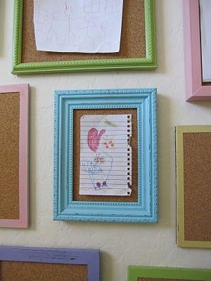 Frames filled with cork board for kids artwork and writings. Cute.