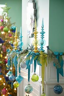 Hang ornaments from ribbons on the mantle