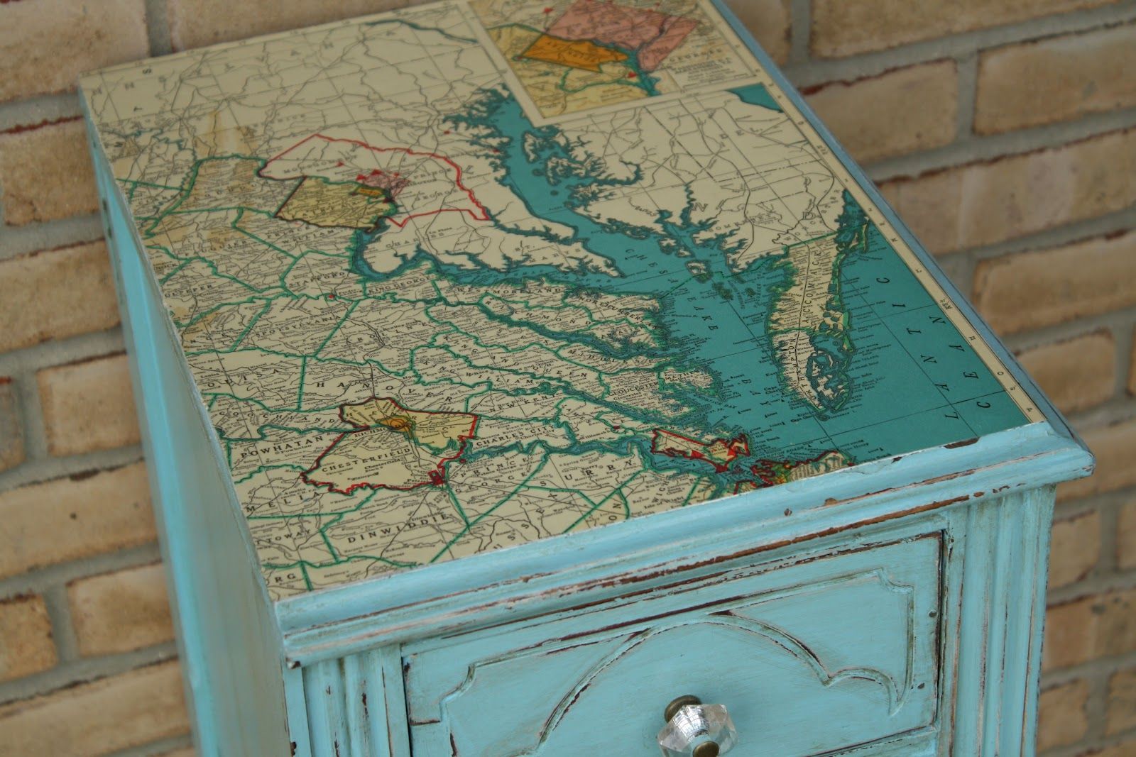 Mod Podge a map to a tabletop.