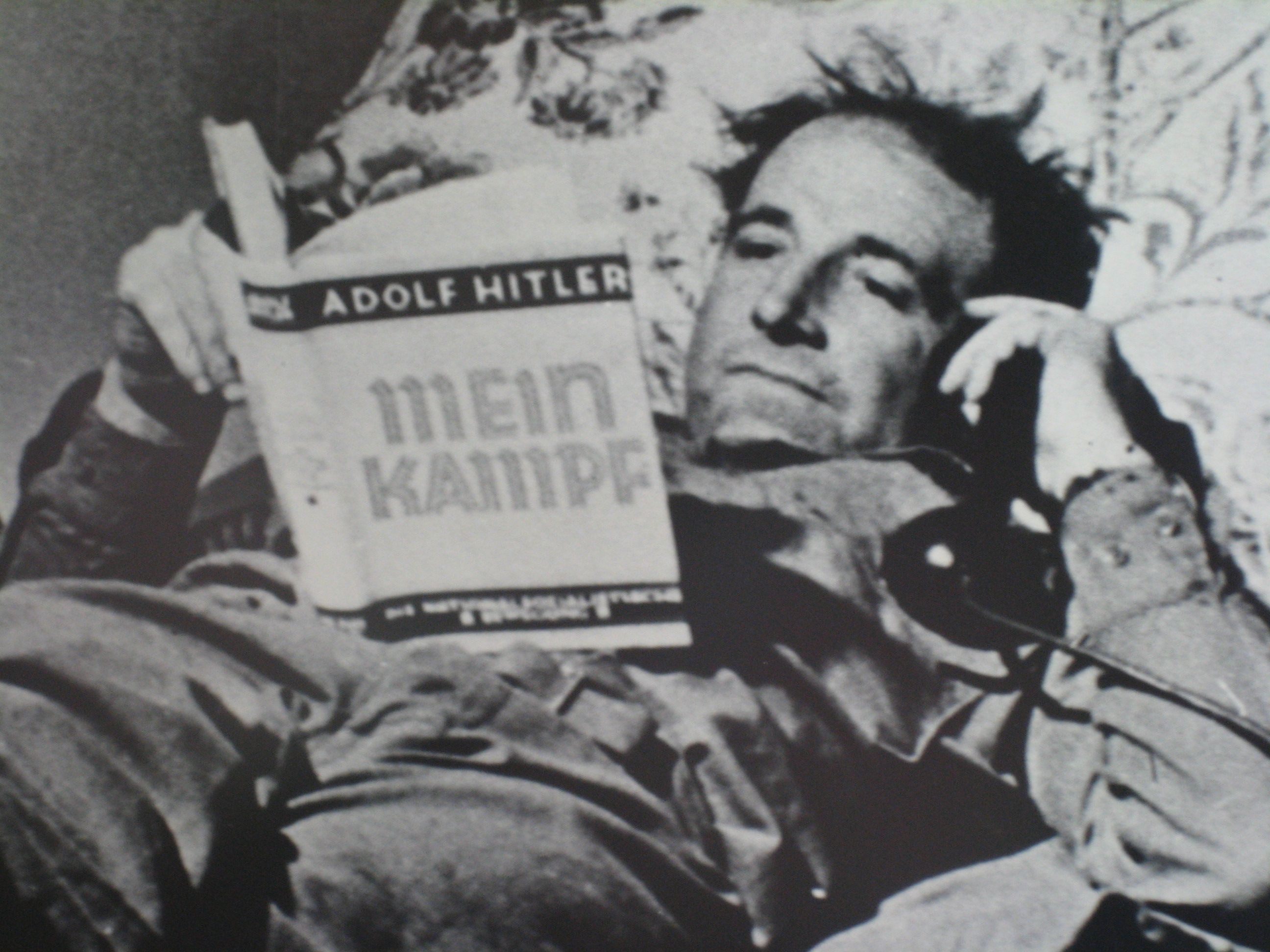 Oklahoma soldier from the 45th, Sgt. Arthur E. Peters, reclining on Hitler&#8217