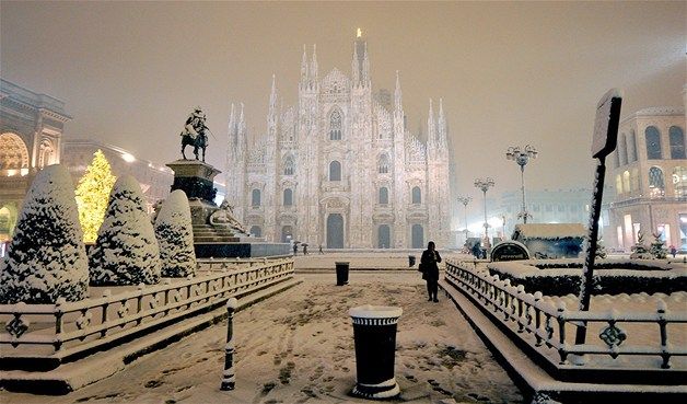 Snow covers the Piazza Duomo square in Milan, Italy