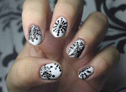 Snowflake nails via fingerpainted