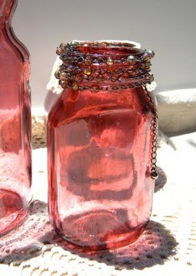 WOW!!! Color glass jars with mod podge and food coloring.  Like this even better