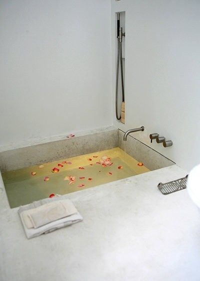 amazing bath with concrete sunken tub