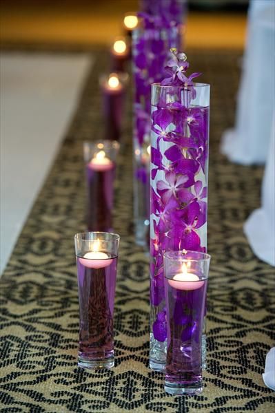 food coloring in glasses with floating candles..  simple and elegant!