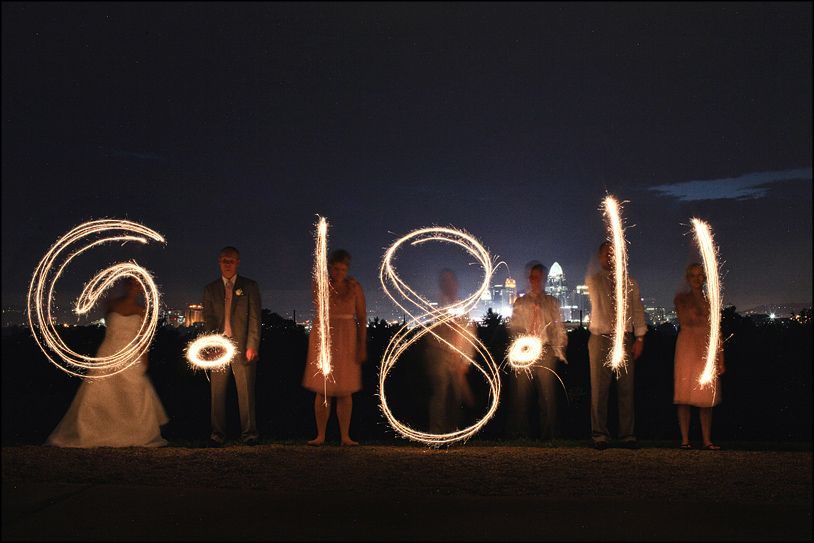 City in the background and the wedding date with sparklers!