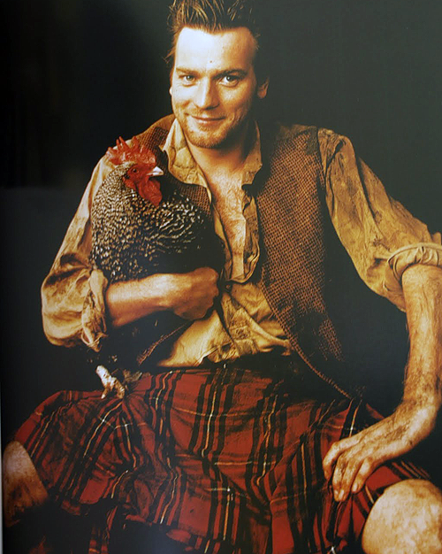 Ewan McGregor in a kilt, holding a chicken. He actually has a pet house duck, bu