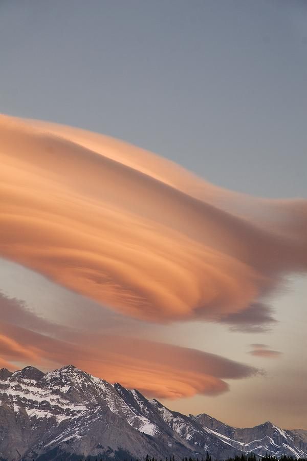 Lenticular clouds at Sunset above Mountain Peaks, Kootenay Plains, Alberta, Cana