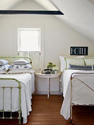 This attic room with twin beds is a perfect hideaway for a guest room. Furniture