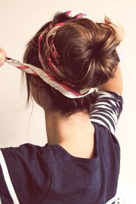 Wrap a head scarf around a bun — Tie your hair into a ponytail and tease one-in