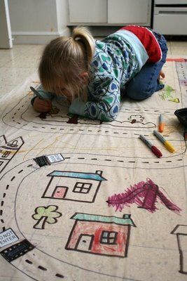 A shower curtain (liner) taped to the kitchen floor. The road is drawn on with p