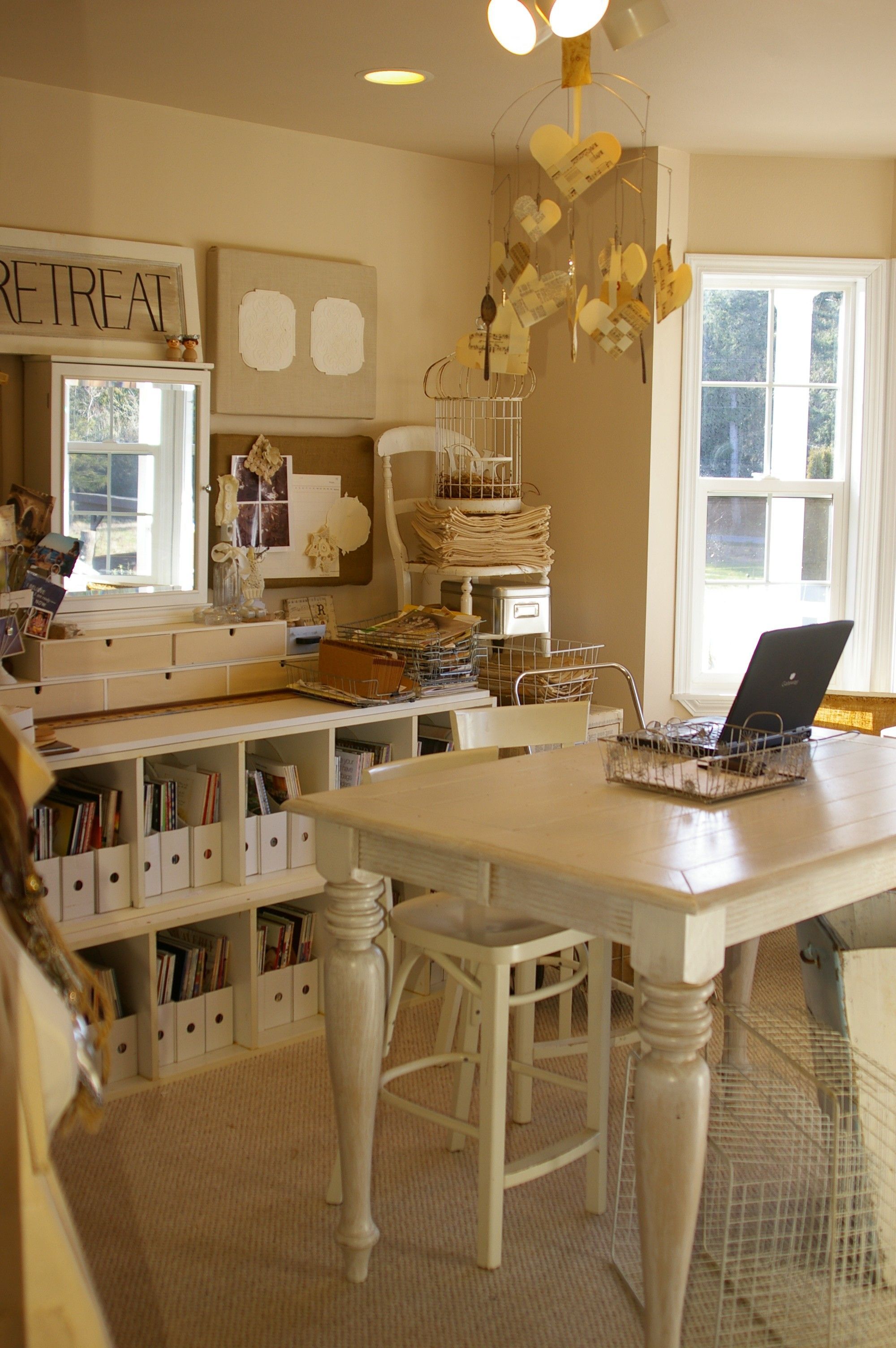 Home office art craft room, white to off white. Great storage and pretty table.