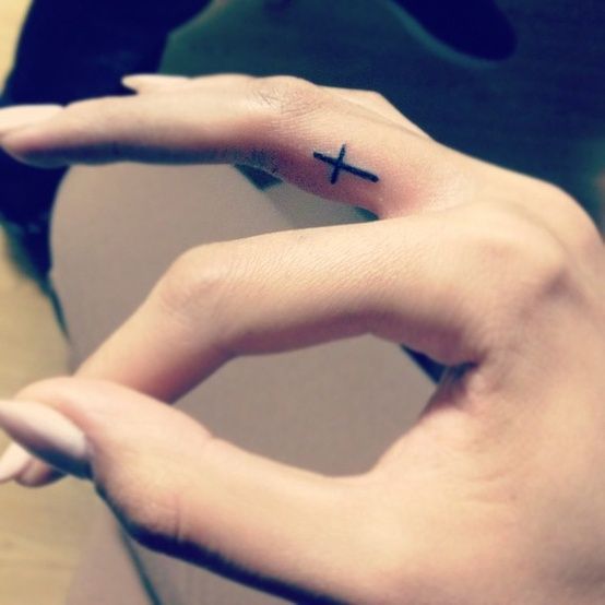 Not the cross tattoo itself but placement. On the side of a finger is pretty sub