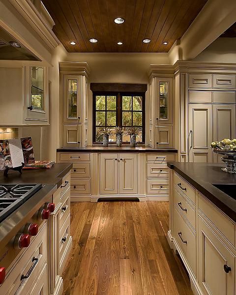 Love! cream cabinets, dark counters and knobs, oak floors and the wood ceiling.