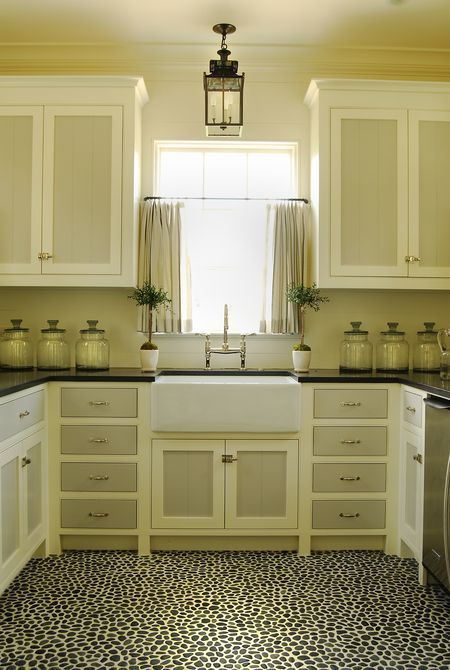 Neutral kitchen with two-tone painted cabinets.  Amazing pebble floor.