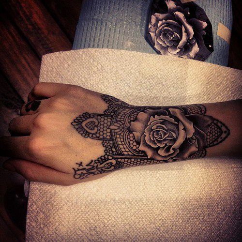 Rose and lace wrist tattoo