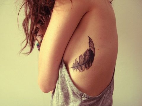 Feather rib cage tattoo!
