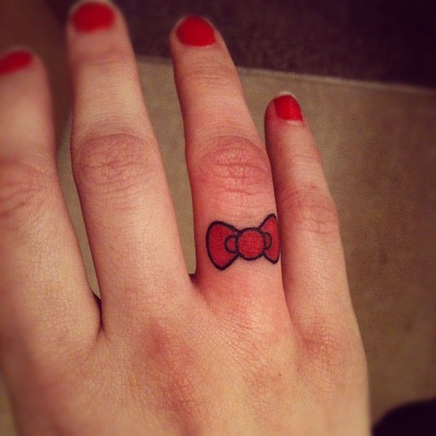 Hello Kitty bow because I like HK and wanted a cute finger tattoo. Simple. Done