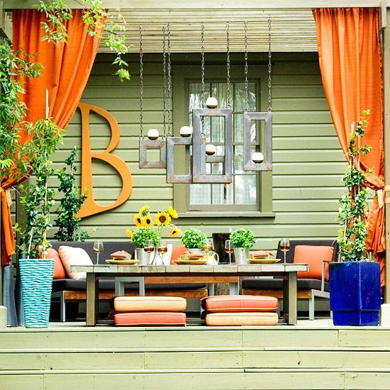 Ideas for the patio… different values of orange with pops of blue. Bright and