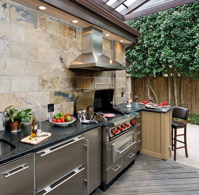 Outdoor Kitchen with Wolf grill and slate backsplash