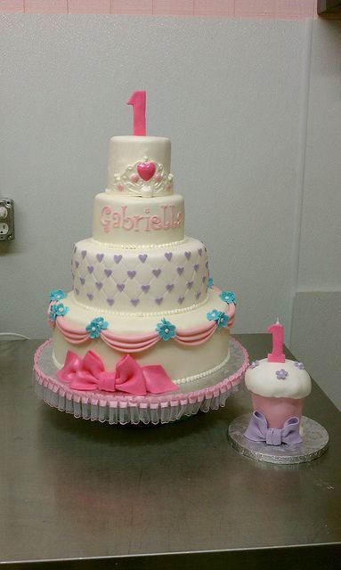 Princess 1st birthday theme cake and matching oversized smash cupcake by Little
