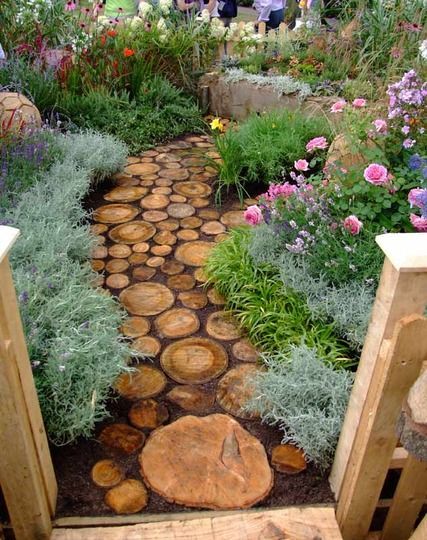 Reuse an old tree to make a log pathway in your garden. — First don't Worry