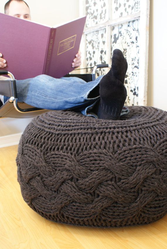 This oversized cabled knitted pouffe footstool/ottoman is pretty awesome. I'