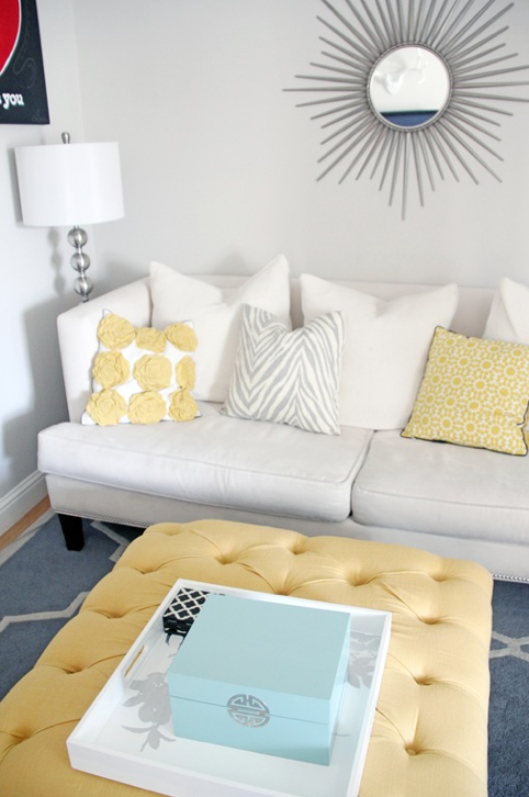 yellow and grey living room – yellow ottoman, patterned pillows