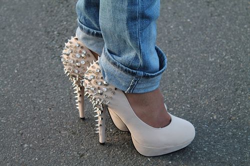 Beige, studded, high-heeled shoes.