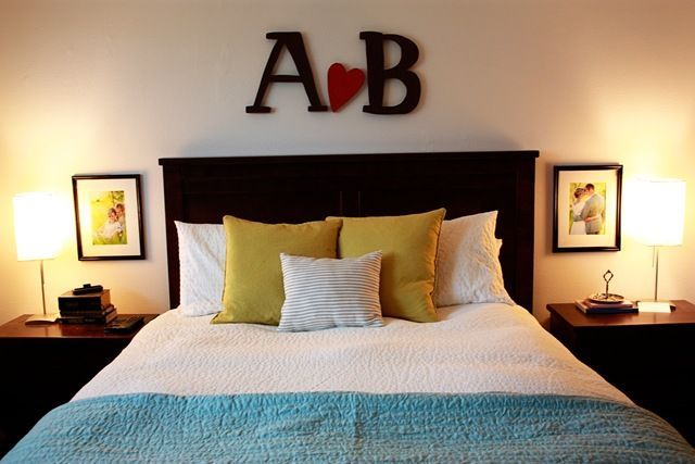 Spouses' initials above headboard with heart in between… and I like the pi