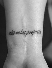 Alis Volat Propriis means "She flies with her own wings."