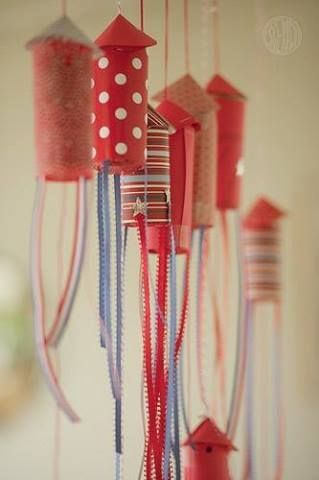 Cute and easy! Cover toilet paper rolls in fabric, attach ribbon and hang for a