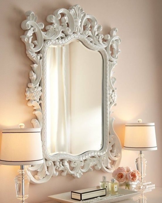 Cute home decor! Love this crisp white mirror and soft pink walls… The glass l