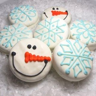 Oreo cookies dipped in melted white chocolate and decorated for winter
