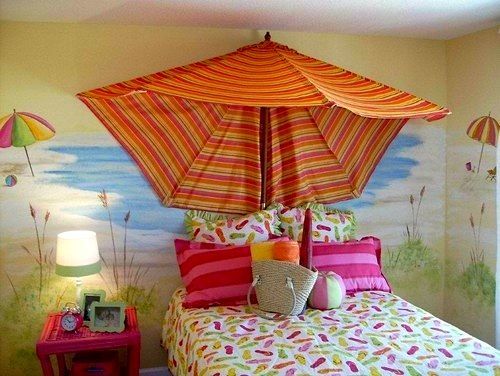 Use a beach unbrella or outdoor umbrella to decorate a beach themed bedroom.