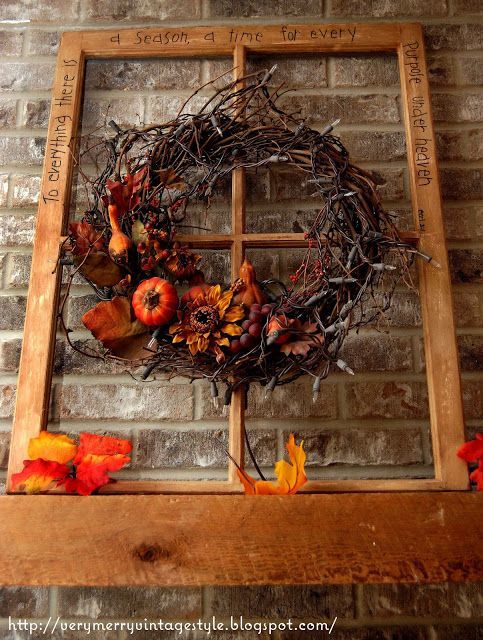 Autumn Grapevine Wreath Hanging on a Vintage Glassless Wooden Window Frame With